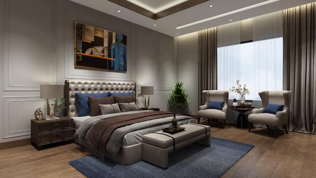 The master bedroom: a buttoned upholstered bed on a deep blue rug, a
                  painting centred above it and a pair of armchairs by the curtained
                  window.