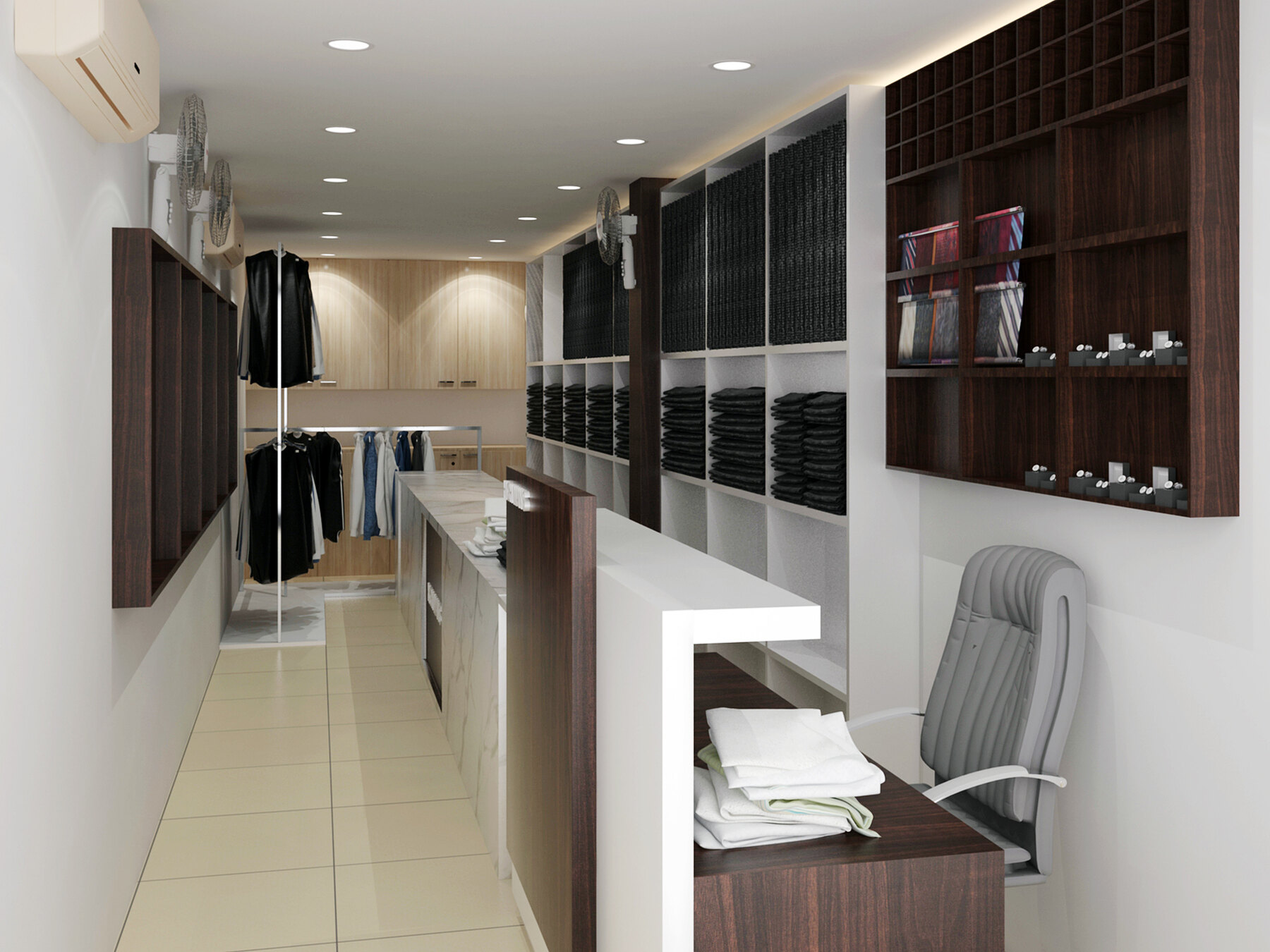 The showroom as designed: a clear tiled floor between a hanging wall and a run of counters and pigeonhole shelving stacked with folded fabric.