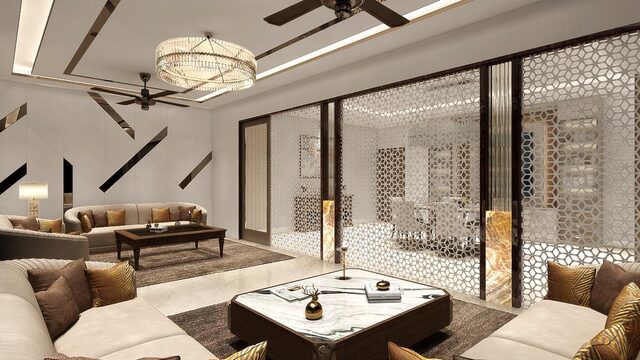 A living room divided by carved jali screens, low seating and a crystal drum pendant above.
