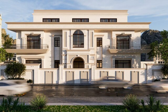 A cream classical mansion: arched openings, columns and a balustraded roofline.