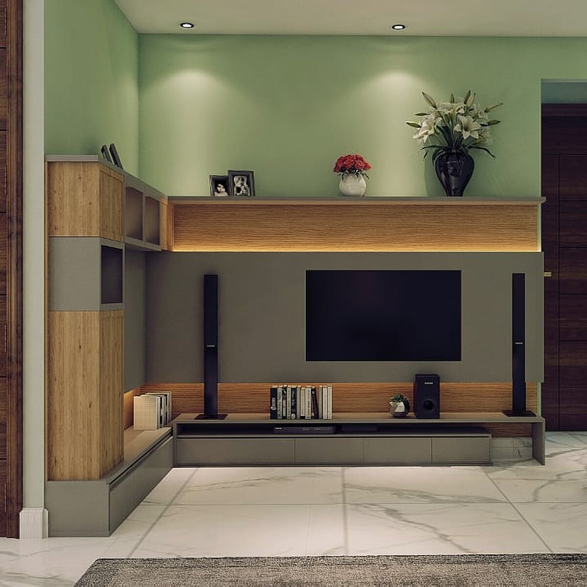 The media wall at Prem Chander: a screen on grey between oak and
               timber joinery, a lit display shelf above and sage green carrying
               the wall behind