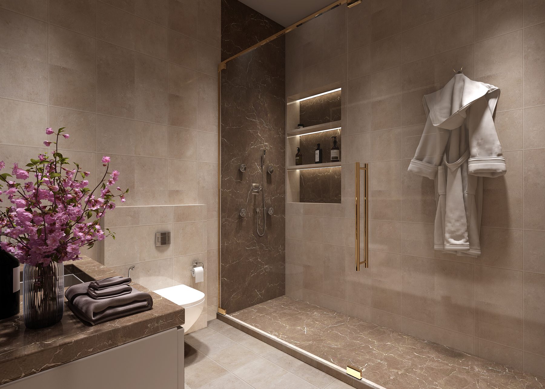 A bathroom: a walk-in shower lined in brown marble with a lit niche, a
                  robe on the hook beside it and the vanity in the foreground.
